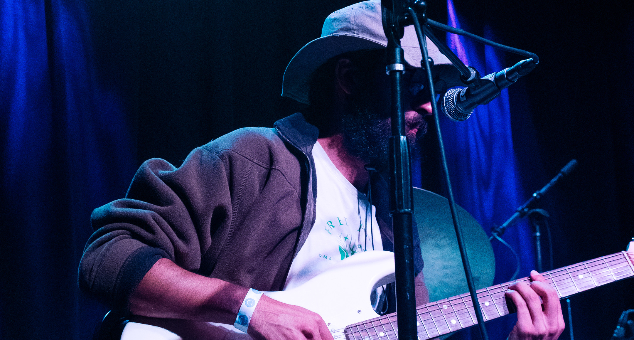 Ameen Wahba playing an electric guitar.