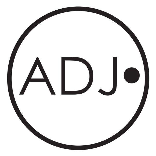 Circular logo with the letters 