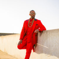 Duane Cyrus, resting on a cement wall