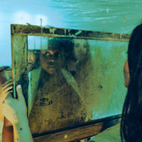 The Next Chapter by Slater Mapp. enVISION: The Next Chapter is an immersive interdisciplinary performance that relies not on sight or sound but on the felt sense of sonic experiences and visual perceptions. In a collective creative process, the work has brought together a team of collaborators around two questions: Can we listen to what we see? Can we see what we hear? Conceived explicitly with and for individuals who are low-vision and blind, as well as low-hearing and deaf, the work proposes a new multisensory experience of dance and theater. The work is presented to a live audience who can choose to experience the show blindfolded or with earbuds, and five audience members are invited to join the experience onstage. This ADF commission builds on enVISION: Sensory Beyond Sight, which premiered at ADF in 2022.