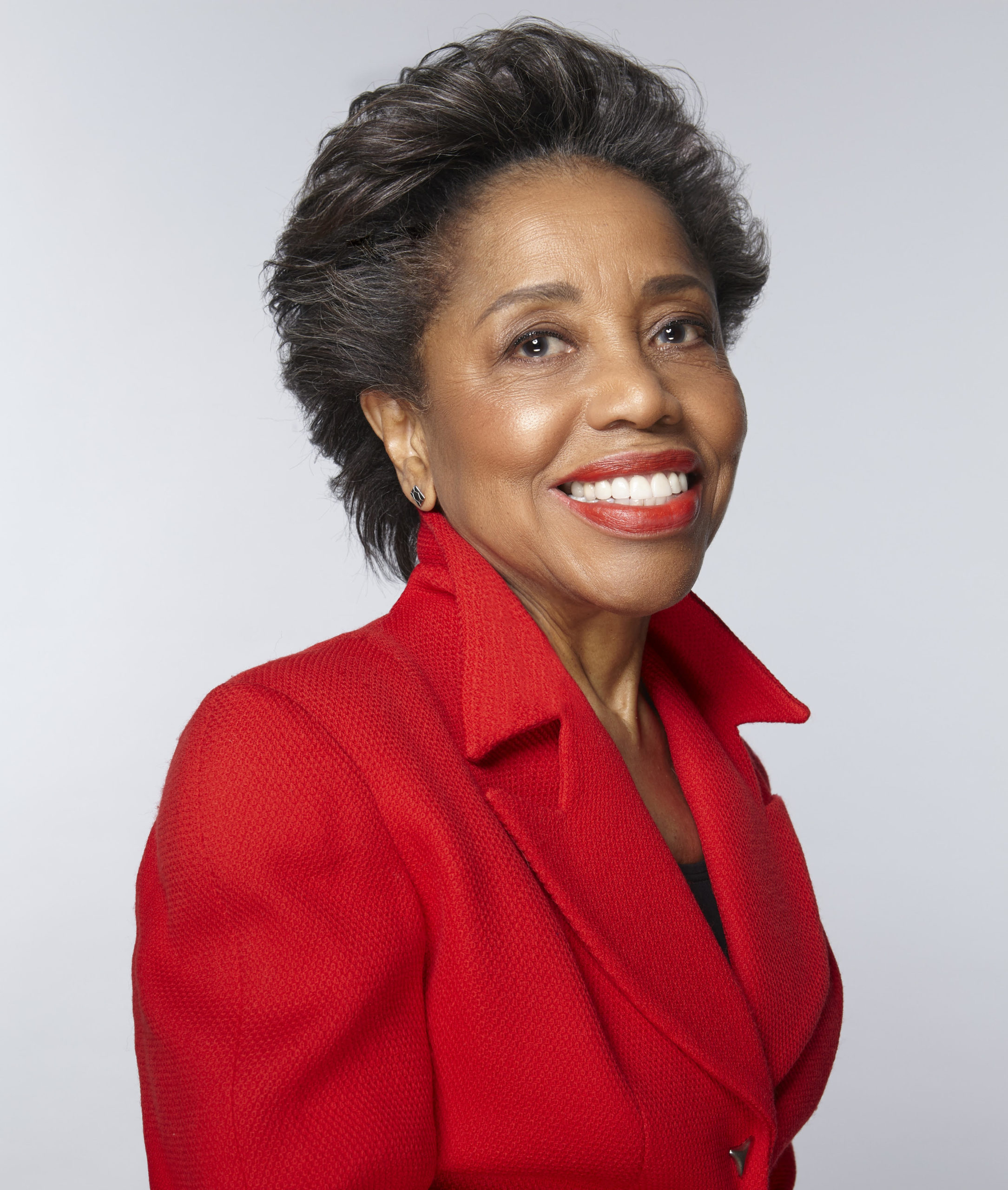 Tania León in a red jacket.