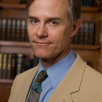 Caucasian man in tan suit