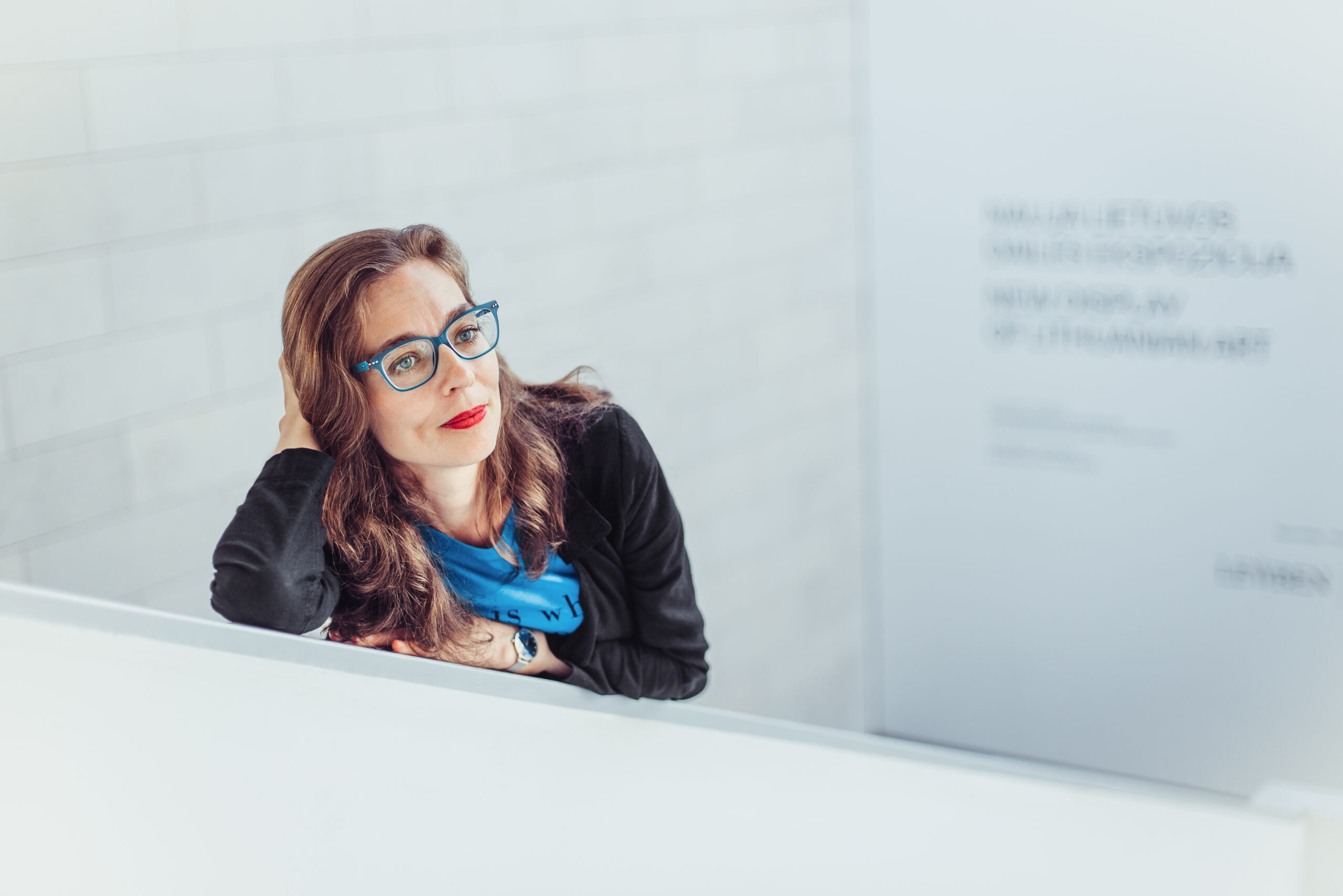 Žibuoklė Martinaitytė leaning against a ledge. (Photo by Tomas Terekas)